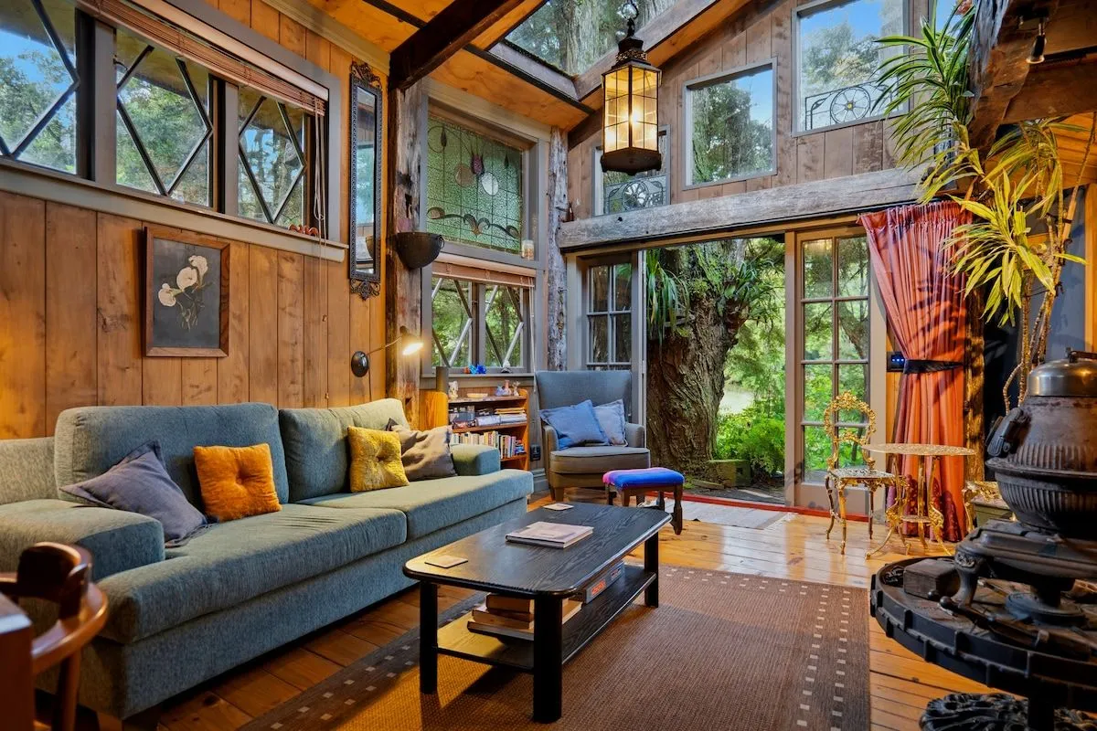 The lounge looking towards french doors that open onto the deck and bush.